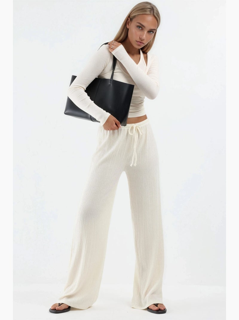 Pantalón de pernera ancha con cintura de cordón busem Crema - Kiabi