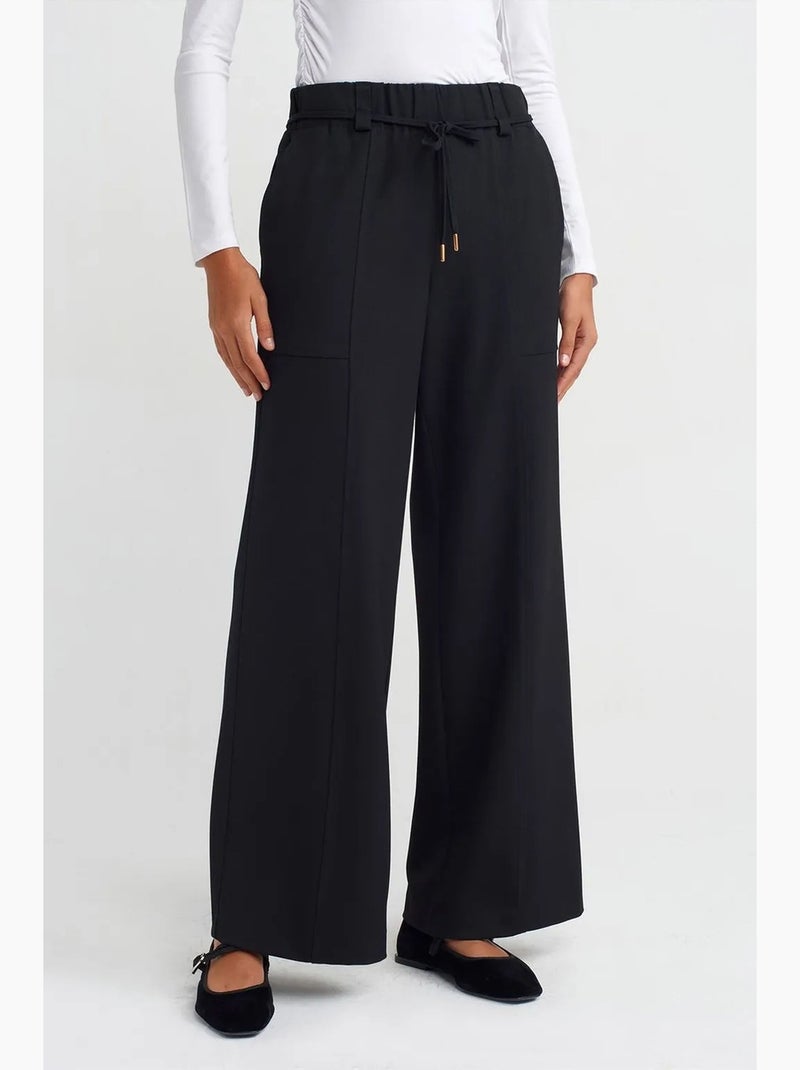 Pantalón de pernera ancha de tejido con cintura elástica y cordón ajustable dilvin Negro - Kiabi