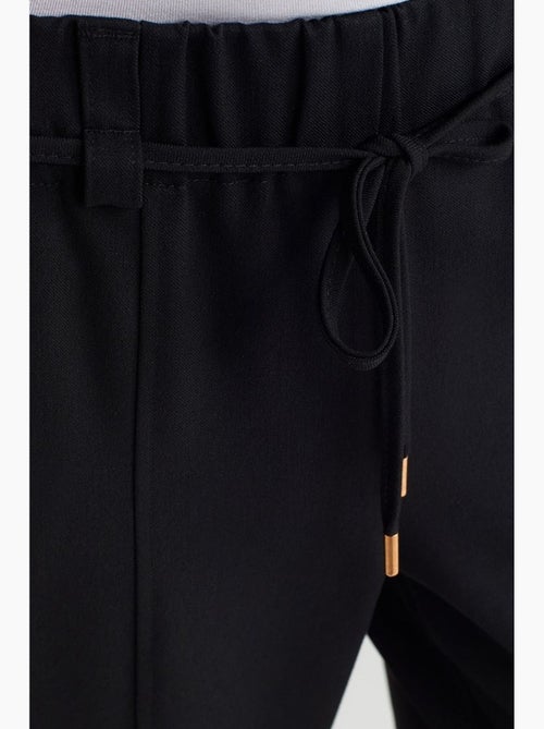 Pantalón de pernera ancha de tejido con cintura elástica y cordón ajustable dilvin - Kiabi Pantalón de pernera ancha de tejido con cintura elástica y cordón ajustable dilvin - Kiabi