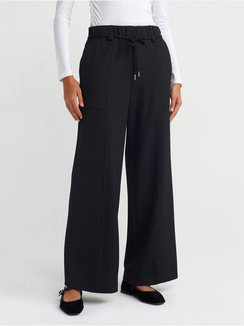 Pantalón de pernera ancha de tejido con cintura elástica y cordón ajustable Negro - Kiabi