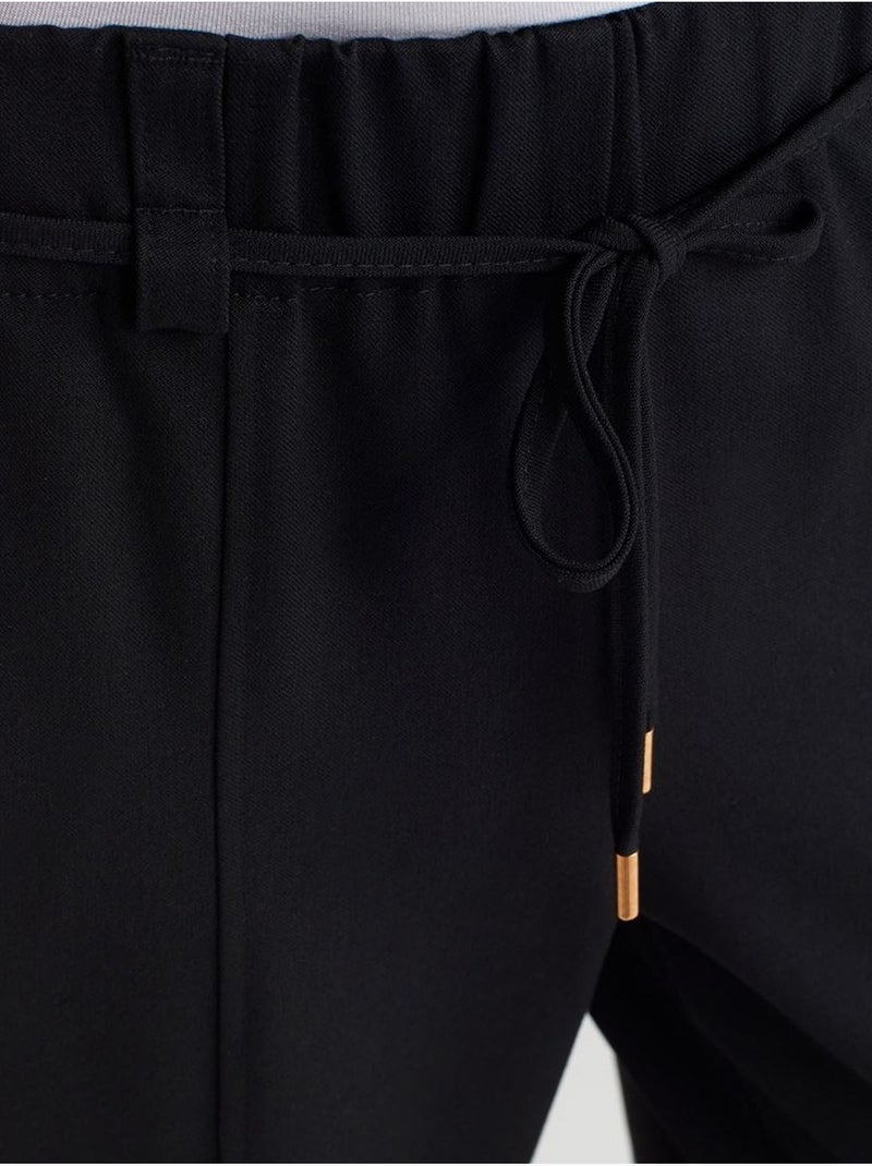 Pantalón de pernera ancha de tejido con cintura elástica y cordón ajustable Negro - Kiabi