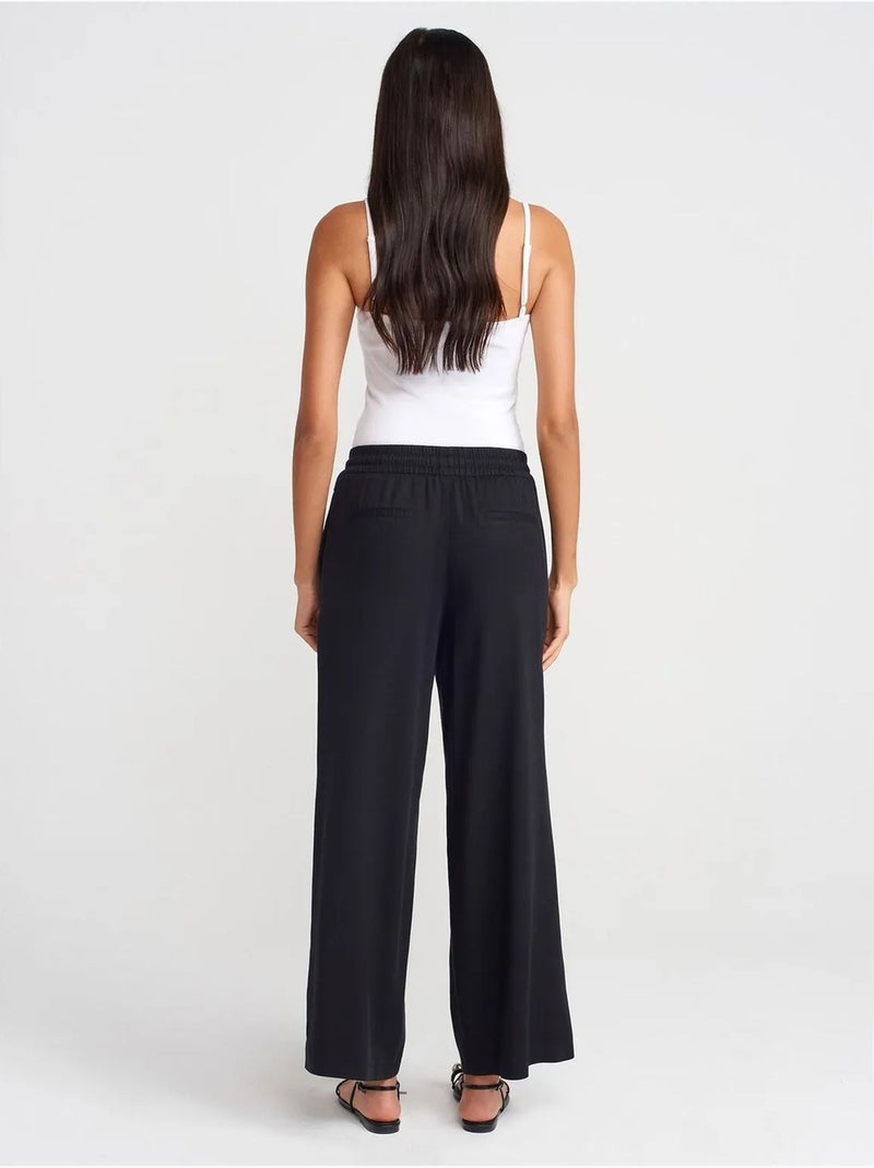 Pantalón de pernera ancha de tencel con cintura con cordón dilvin Negro - Kiabi