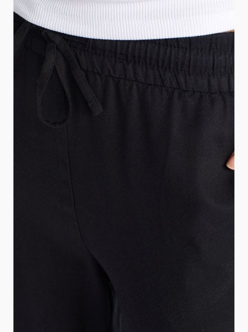 Pantalón de pernera ancha de tencel con cintura con cordón dilvin - Kiabi Pantalón de pernera ancha de tencel con cintura con cordón dilvin - Kiabi