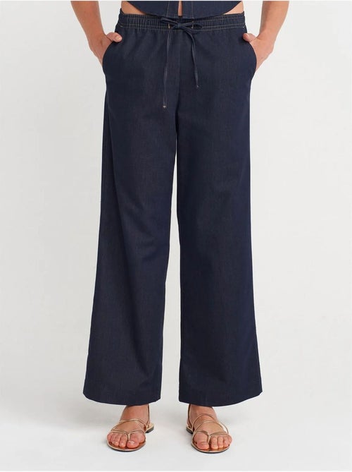 Pantalón de tejido con pernera ancha y cintura con cordón dilvin - Kiabi Pantalón de tejido con pernera ancha y cintura con cordón dilvin - Kiabi