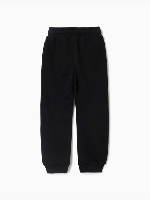 Pantalón deportivo con estampado que brilla en la oscuridad - Kiabi Pantalón deportivo con estampado que brilla en la oscuridad - Kiabi
