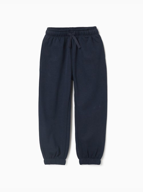 Pantalón deportivo de felpa con cordón y bolsillos - Kiabi Pantalón deportivo de felpa con cordón y bolsillos - Kiabi