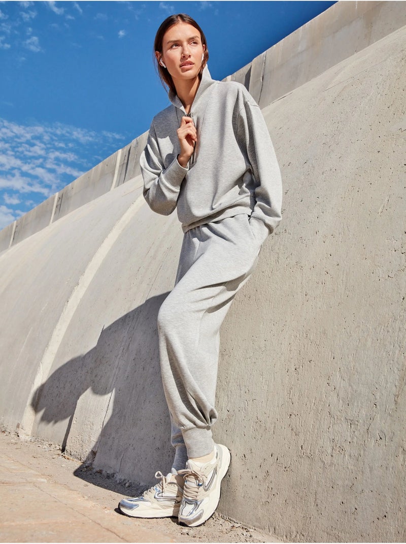 Pantalón jogger con bolsillos en tejido double soft touch Gris - Kiabi