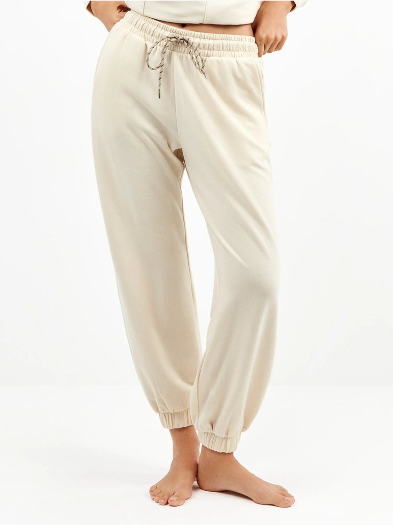 Pantalón jogger con bolsillos y cintura ajustable, en tejido de felpa Beige - Kiabi