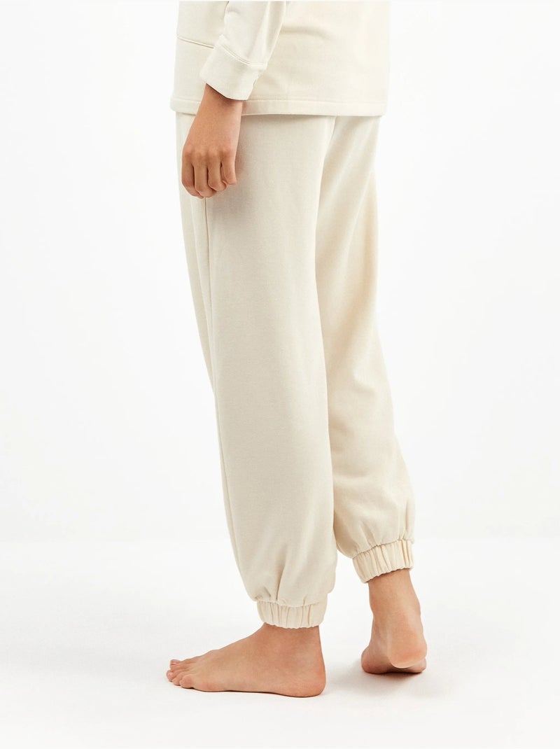 Pantalón jogger con bolsillos y cintura ajustable, en tejido de felpa Beige - Kiabi