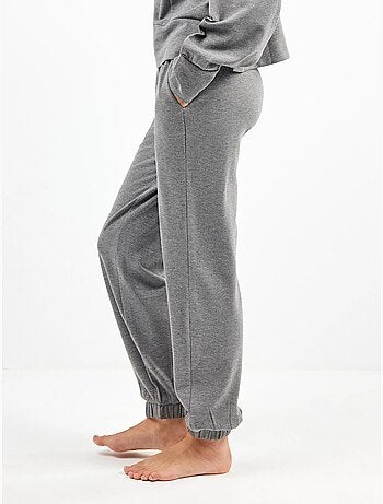 Pantalón jogger con bolsillos y cintura ajustable, en tejido de felpa