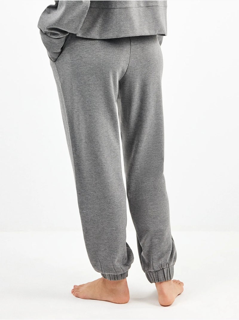 Pantalón jogger con bolsillos y cintura ajustable, en tejido de felpa Gris jaspeado - Kiabi