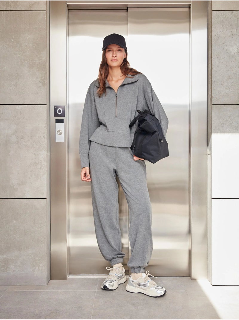 Pantalón jogger con bolsillos y cintura ajustable, en tejido de felpa Gris jaspeado - Kiabi