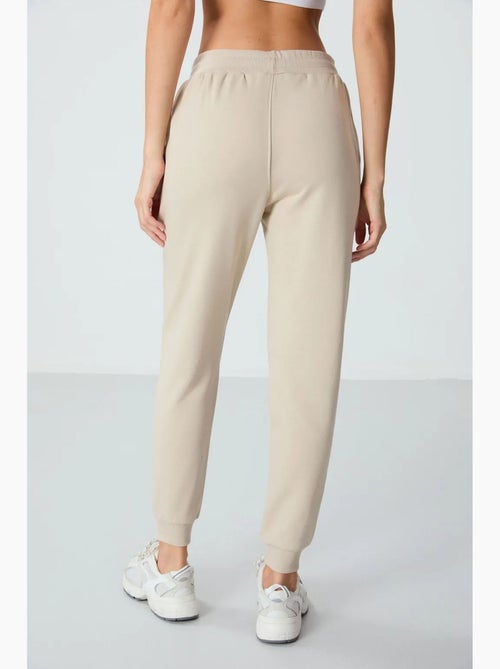 Pantalón jogger de chándal de mezcla de algodón para mujer tommy - Kiabi Pantalón jogger de chándal de mezcla de algodón para mujer tommy - Kiabi