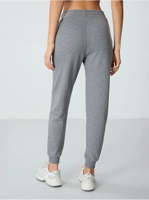 Pantalón jogger de chándal de mezcla de algodón para mujer tommy - Kiabi Pantalón jogger de chándal de mezcla de algodón para mujer tommy - Kiabi