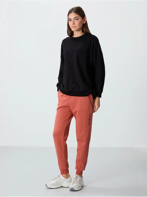 Pantalón jogger de chándal de mezcla de algodón para mujer tommy - Kiabi Pantalón jogger de chándal de mezcla de algodón para mujer tommy - Kiabi
