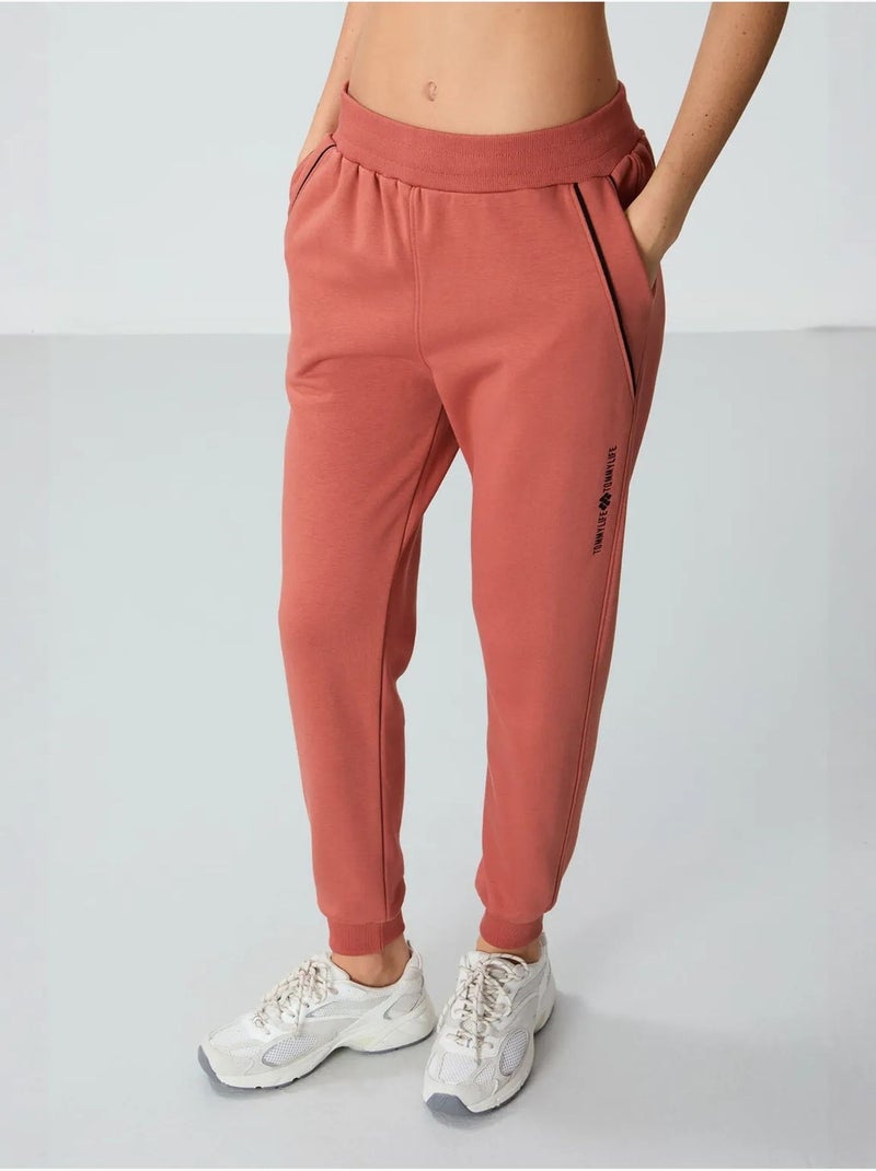 Pantalón jogger de chándal de mezcla de algodón para mujer tommy Terracota - Kiabi