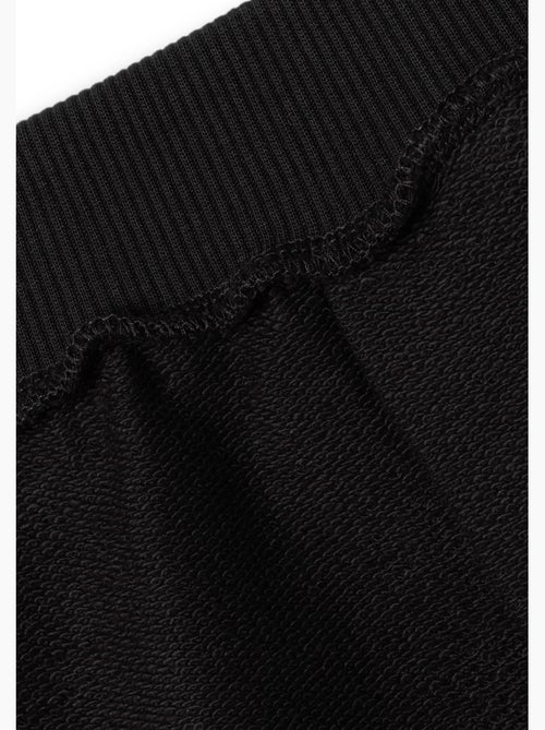 Pantalón jogger de felpa negro conguitos - Kiabi