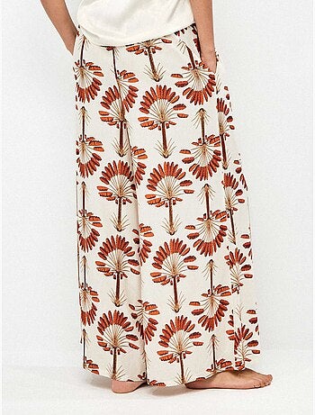Pantalón largo ancho con estampado de palmeras