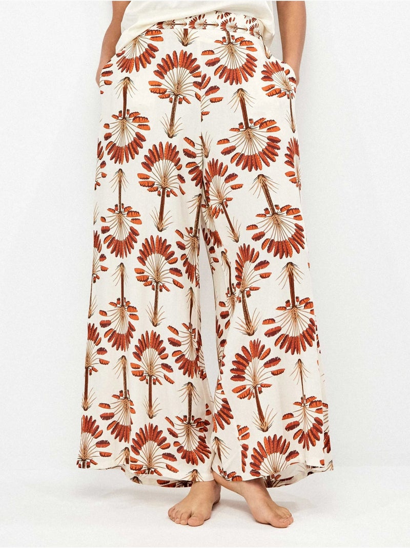 Pantalón largo ancho con estampado de palmeras Multicolor - Kiabi