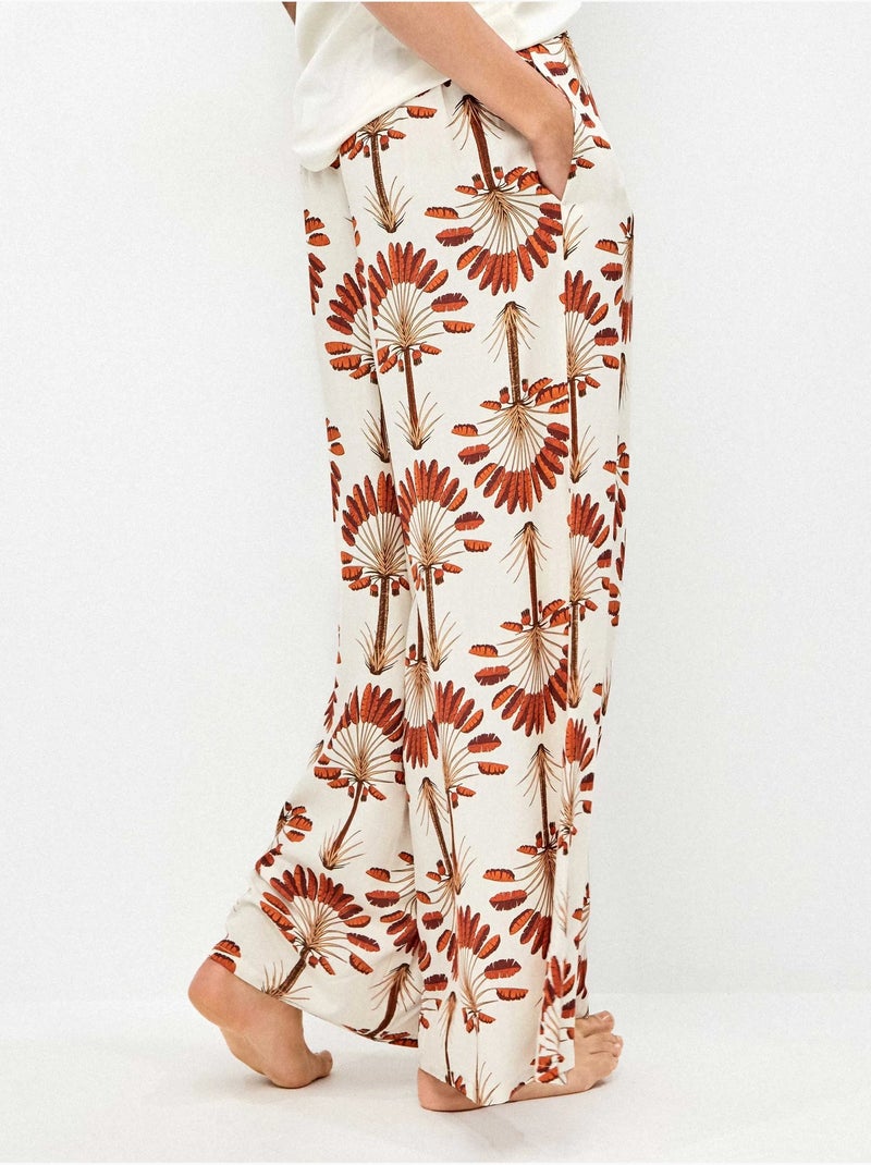 Pantalón largo ancho con estampado de palmeras Multicolor - Kiabi