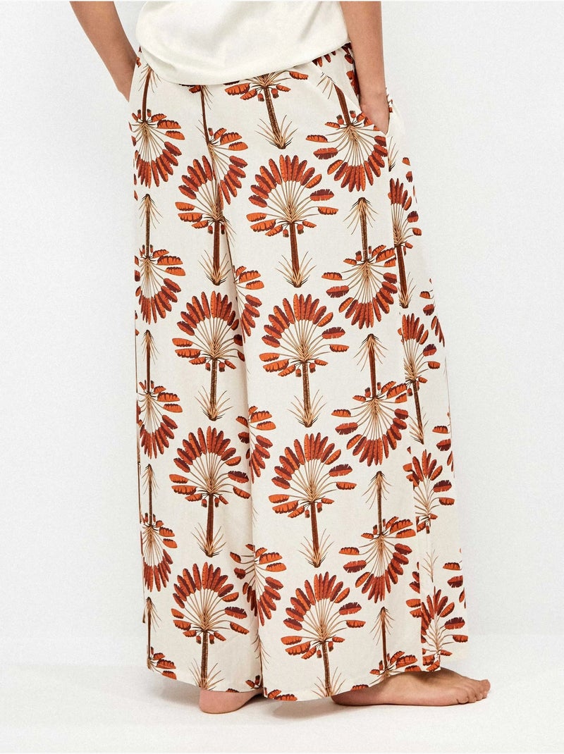Pantalón largo ancho con estampado de palmeras Multicolor - Kiabi