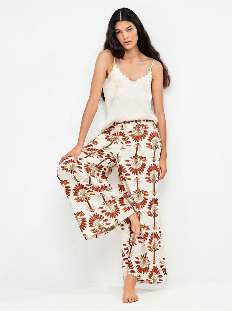 Pantalón largo ancho con estampado de palmeras Multicolor - Kiabi