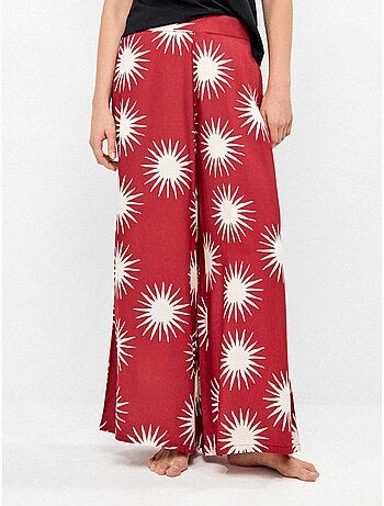 Pantalón largo ancho con estampado de soles