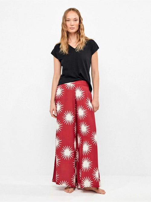Pantalón largo ancho con estampado de soles - Kiabi Pantalón largo ancho con estampado de soles - Kiabi