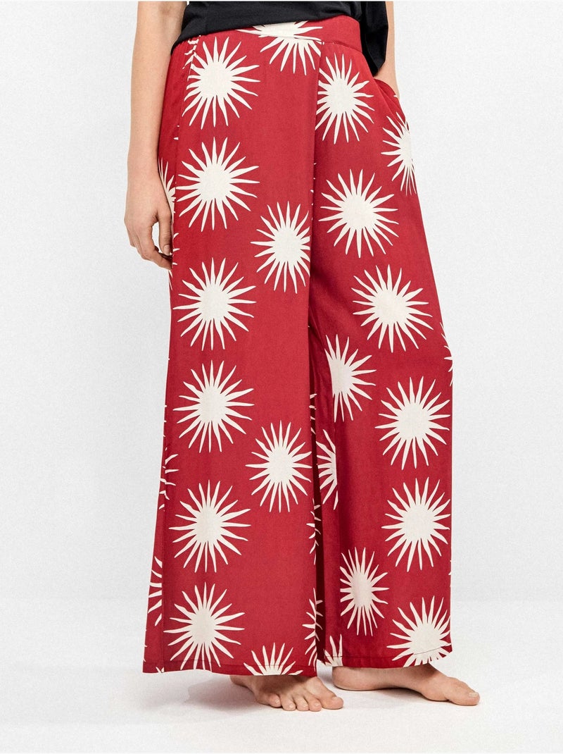 Pantalón largo ancho con estampado de soles Multicolor - Kiabi