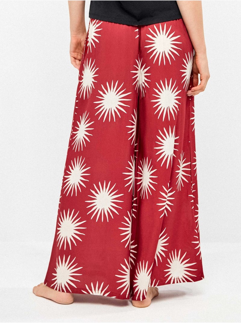 Pantalón largo ancho con estampado de soles Multicolor - Kiabi
