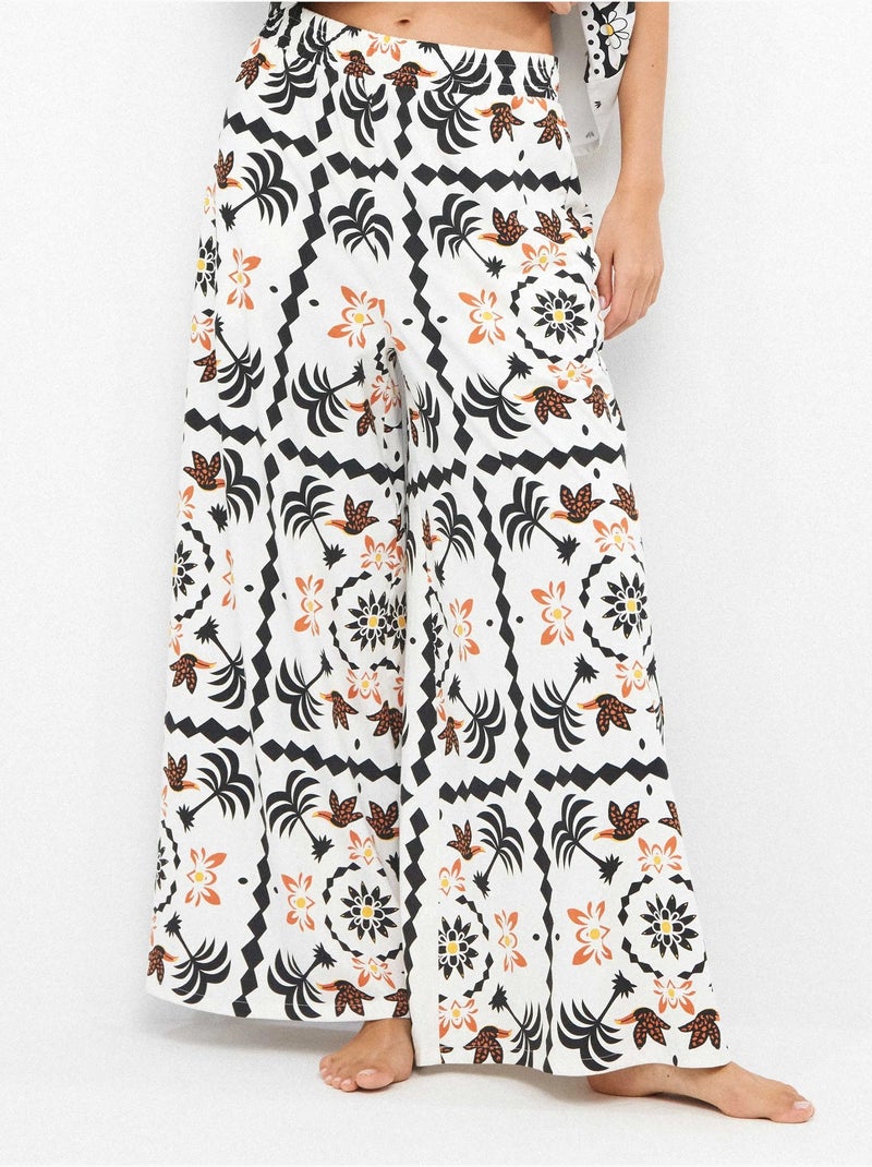 Pantalón largo ancho con estampado tropical con algodón Multicolor - Kiabi