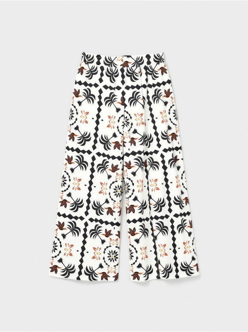 Pantalón largo ancho con estampado tropical con algodón - Kiabi Pantalón largo ancho con estampado tropical con algodón - Kiabi