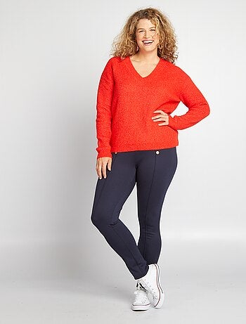 Pantalón legging con botones dorados