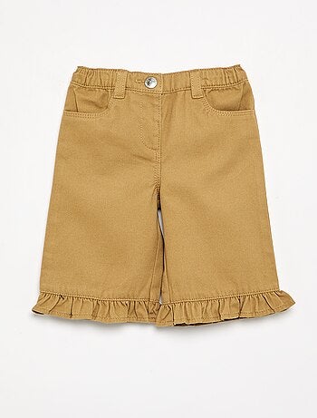 Pantalón liso con bajo volanteado