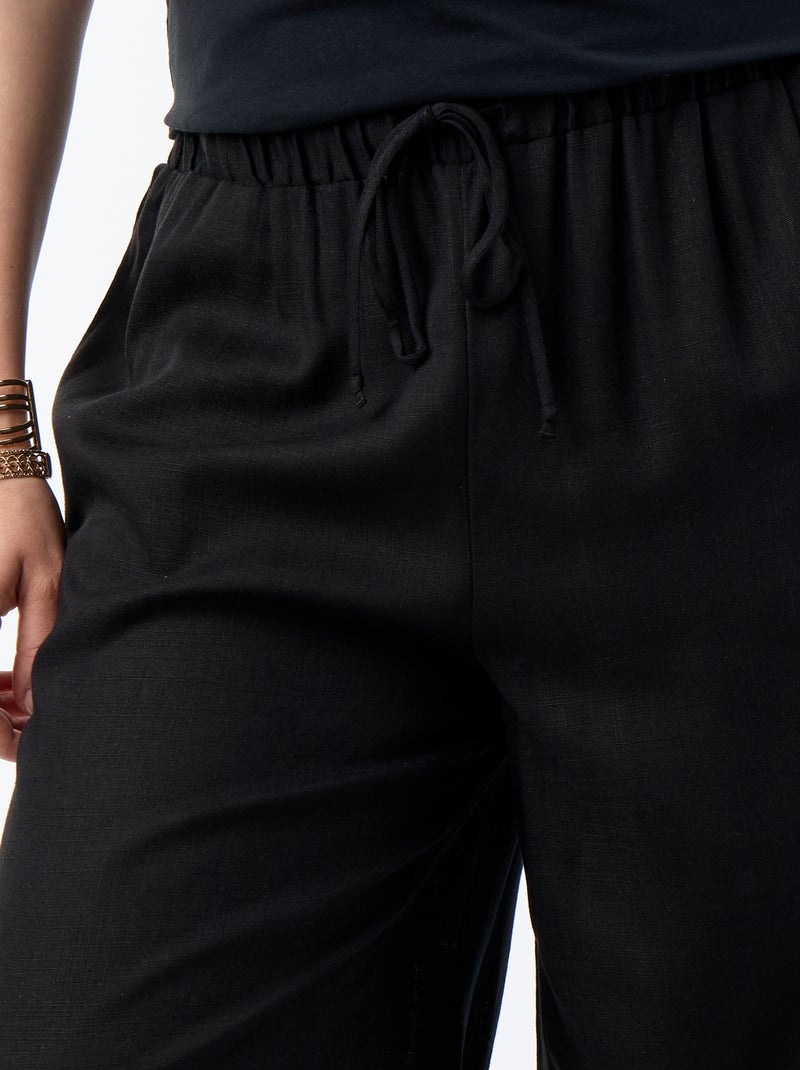 Pantalón liso de corte globo Negro - Kiabi