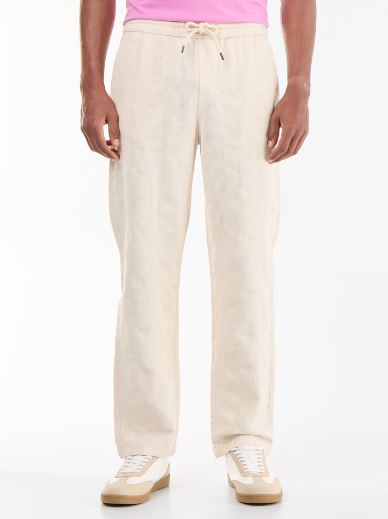 Pantalón liso de tejido texturizado Beige - Kiabi