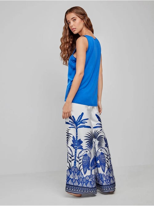 Pantalón palazzo con estampado tropical en tejido de satén - Kiabi Pantalón palazzo con estampado tropical en tejido de satén - Kiabi
