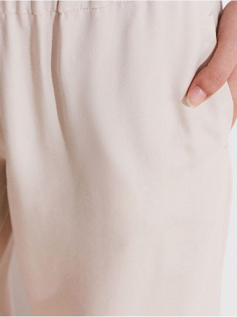 Pantalón palazzo de tencel de tiro alto y pernera ancha dilvin Beige arcilla - Kiabi