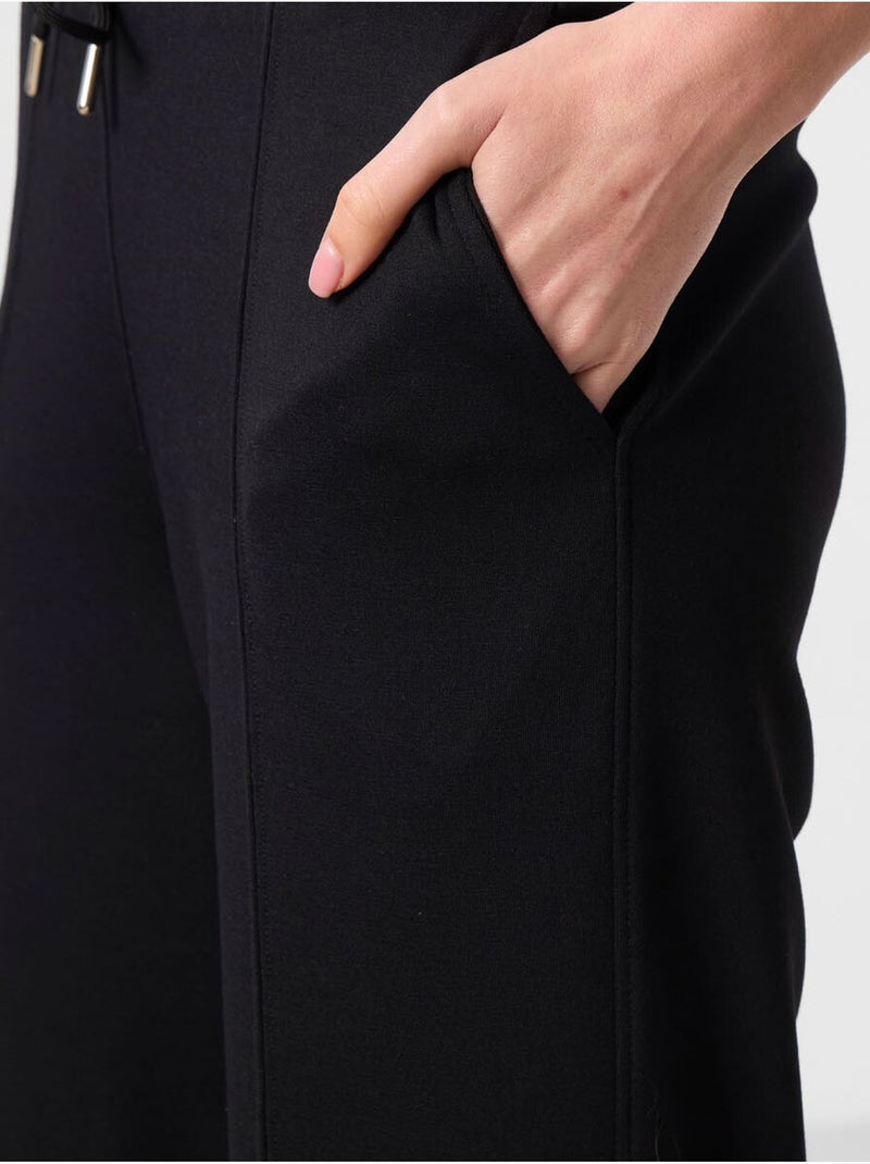 Pantalón palazzo texturizado de pernera ancha con cintura de cordón tommy Negro - Kiabi