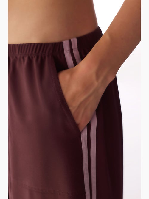 Pantalón parachute de pierna ancha con detalle de lazo penti - Kiabi Pantalón parachute de pierna ancha con detalle de lazo penti - Kiabi