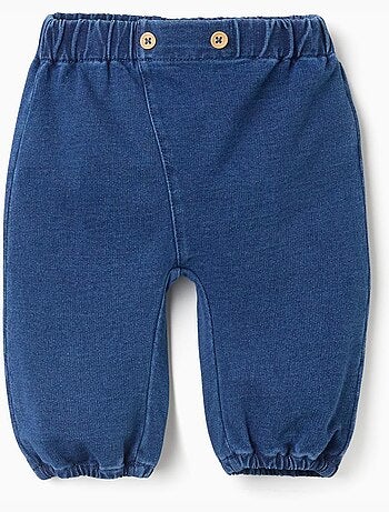 Pantalón vaquero con botones decorativos