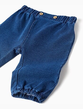 Pantalón vaquero con botones decorativos