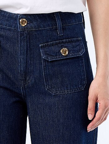 Pantalón vaquero crudo wide leg con botones dorados