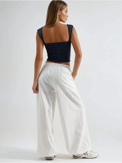 Pantalones anchos con cintura con cordón busem - Kiabi Pantalones anchos con cintura con cordón busem - Kiabi