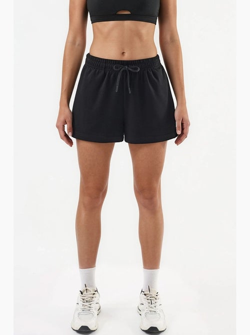 Pantalones cortos de punto de talle medio y corte relajado hiccup - Kiabi Pantalones cortos de punto de talle medio y corte relajado hiccup - Kiabi