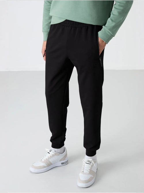 Pantalones de chándal de hombre de mezcla de algodón tommy - Kiabi Pantalones de chándal de hombre de mezcla de algodón tommy - Kiabi