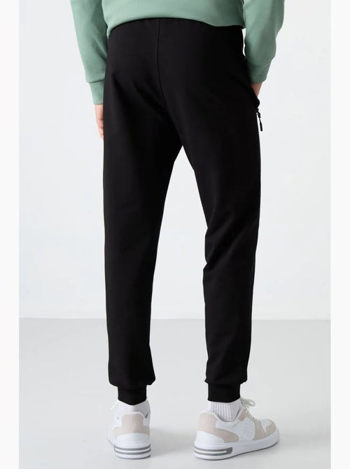 Pantalones de chándal de hombre de mezcla de algodón tommy - Kiabi Pantalones de chándal de hombre de mezcla de algodón tommy - Kiabi