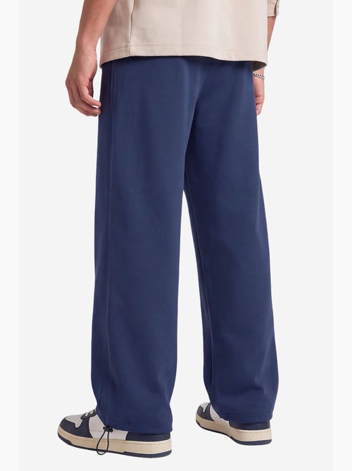 Pantalones de chándal de hombre en mezcla de algodón tommy - Kiabi Pantalones de chándal de hombre en mezcla de algodón tommy - Kiabi