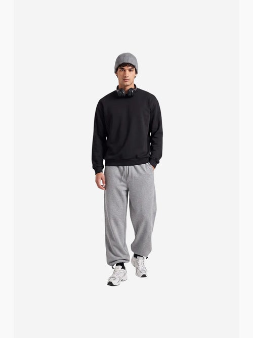 Pantalones de chándal de hombre en mezcla de algodón tommy - Kiabi Pantalones de chándal de hombre en mezcla de algodón tommy - Kiabi