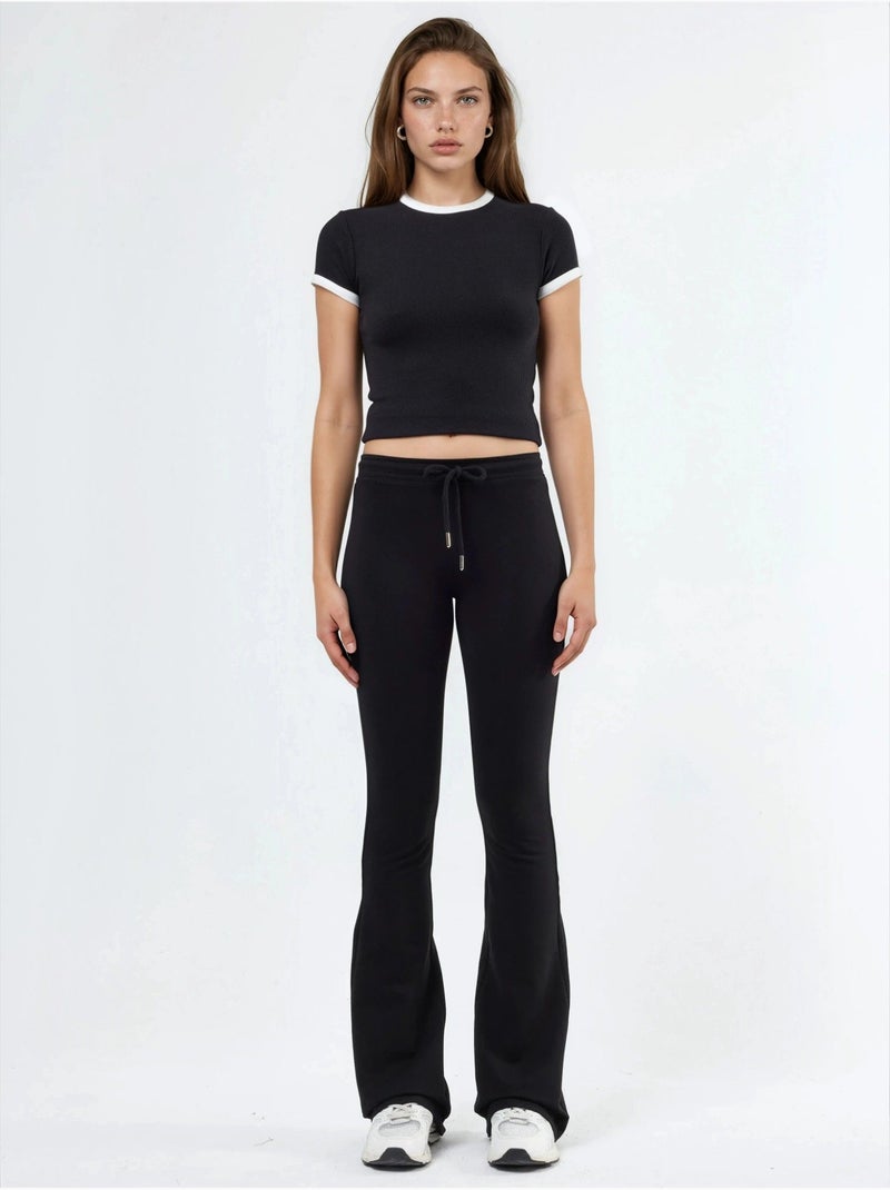 Pantalones de chándal de pierna acampanada de talle medio con cordón busem Negro - Kiabi